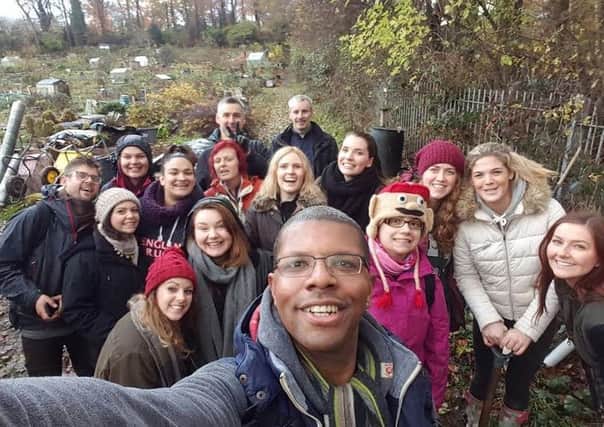 CHARITY VOLUNTEERING: The Morgans team lends a helping hand at Hollin Lane Allotments.