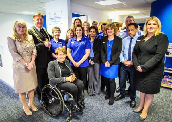 Staff at the William Merritt Disabled Living Centre celebrate after moving into a new  building in Rodley which was officially opened by Baroness Tanni Grey-Thompson.