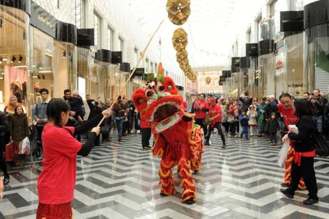 TRADITION: Members of the Chinese community perform Lion Dance.