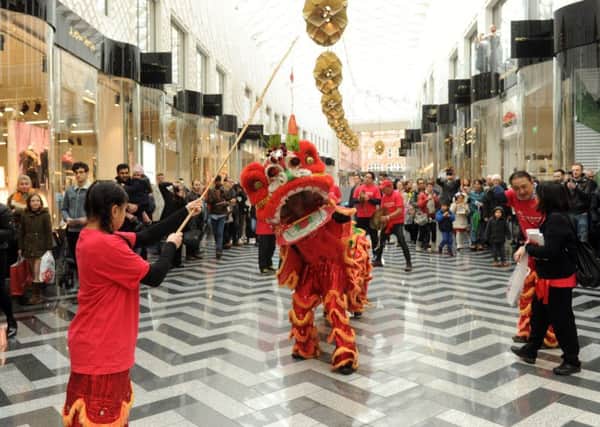 TRADITION: Members of the Chinese community perform Lion Dance.