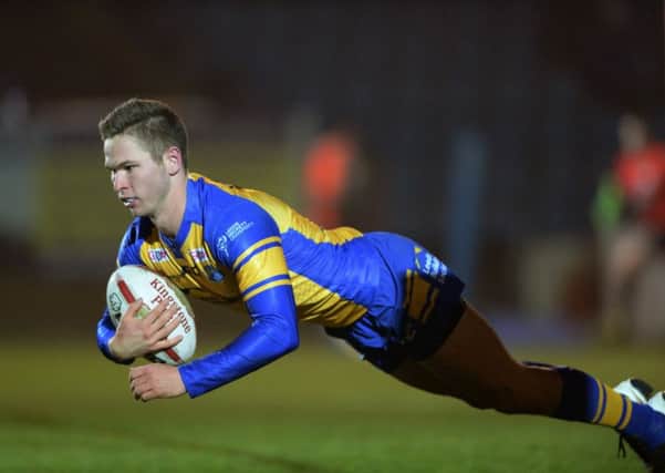 Matt Parcell dives over the line for his first try for Leeds.