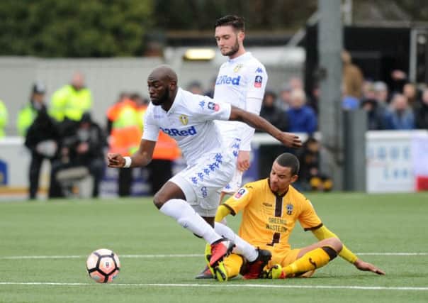 Souleymane Doukara gets away from Sutton United's Craig Eastman. PIC: Jonathan Gawthorpe