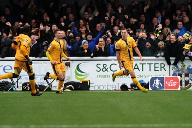 Sutton captain Jamie Collins celebrates after scoring the winning goal.
Picture: Jonathan Gawthorpe