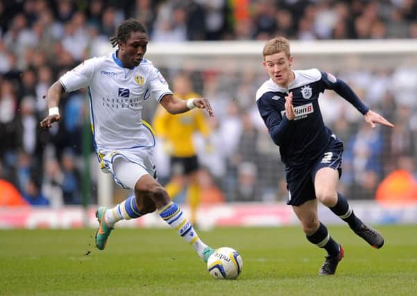 MARCH 2013: Habib Habibou and Huddersfield Town's Paul Dixon battle for the ball. PIC: PA