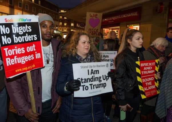 Protesters gather in Leeds to demonstrate against President Trump's immigration policies and his planned state visit to the UK.