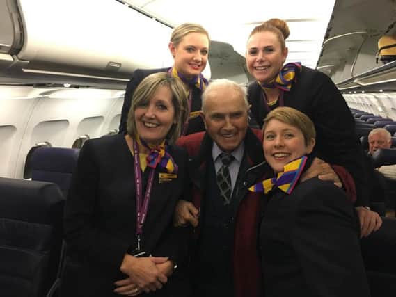 Harold Terry, 101, with Monarch cabin crew on the Leeds Bradford - Malaga route