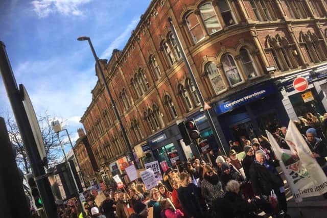 Protesters marching on Briggate, Leeds city centre. Pic: Leeds SUTR.