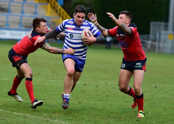 Halifax's Scott Murrell on the charge against Featherstone.