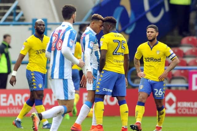 FLASHPOINT: Leeds United's Ronaldo Viera clashes with Huddersfield Town's Rajiv Van La Parra. Picture: Tony Johnson