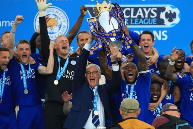 Leicester City captain Wes Morgan and manager Claudio Ranieri celebrate winning the Barclays Premier League title last season. They are now just a point above the drop zone.