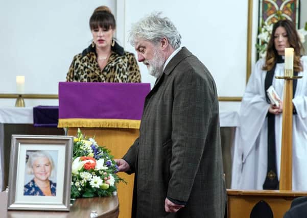 Zak Dingle played by Steve Haliwell who is paying his respects during the funeral service for his estranged wife Joanie Wright, as Kerry Wyatt (left) played by Laura Norton tearfully rants at him for letting down Joanie both in life and death, during an episode of Emmerdale. PIC: PA