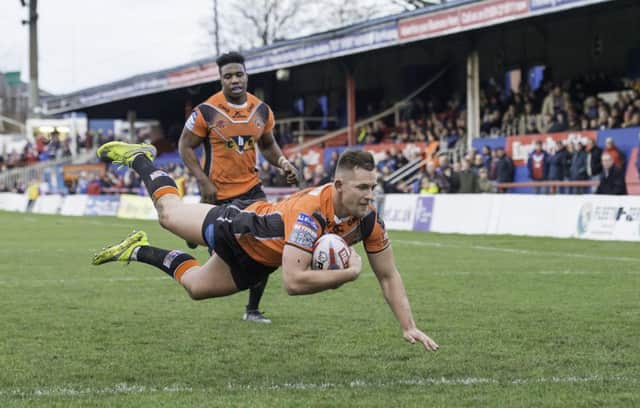 FAMILIAR FACE: Greg Eden dives over for a try against Wakefield in last month's pre-season encounter. Picture: Allan McKenzie.