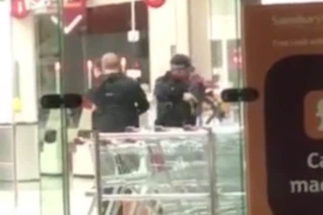 Armed police in a Sainsburys store in Leeds. A still from a video sent in by Josh Carver, 22.