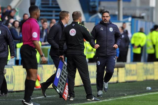 Garry Monk and David Wagner clash during the West Yorkshire derby.
