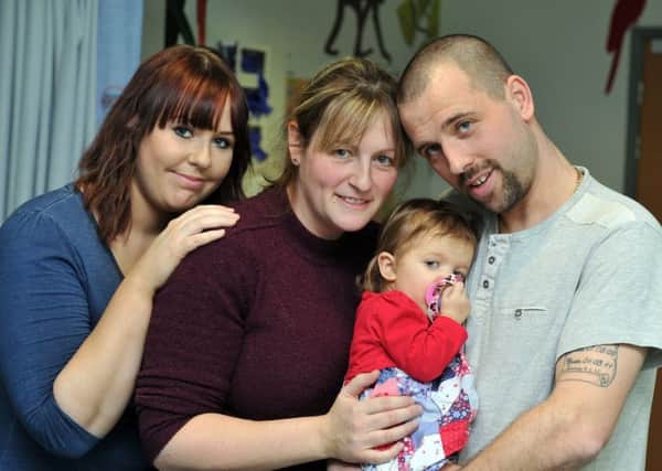 Summer-Rose Thompson at the LGI's children's ward who has leukaemia is undergoing treatment, pictured with parents Becky and Gareth Thompson and her aunt Kirsty Monaghan, left, who is raising money for Cancer Research UK. PIC:  Tony Johnson.