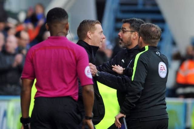 Leeds boss Garry Monk confronts counterpart David Wagner after he celebrated his teams winner on the pitch with the players. (Picture: Tony Johnson)