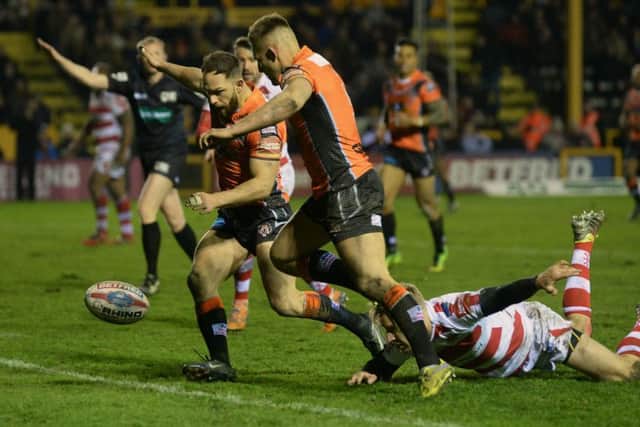 Luke Gale (with Greg Eden) prepares to touch down for Tigers' sixth try.