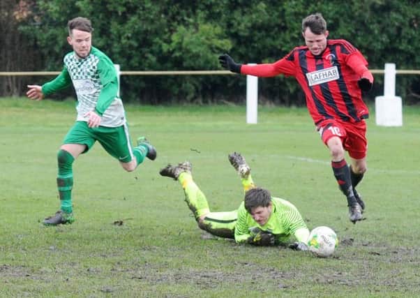 Jamie Lister scores for Robin Hood in a 4-1 win over Field. PIC: Steve Riding