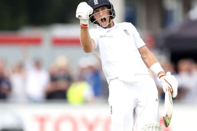 England's Joe Root celebrates his double century against Pakistan. (Picture: Martin Rickett/PA Wire)