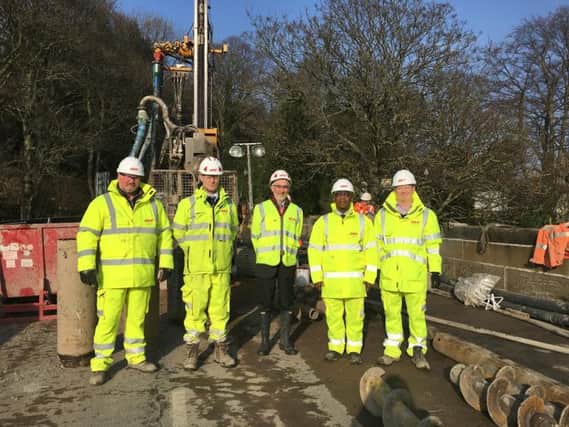 Left to right: Tim Smith, Clerk of works, Site Manager, Gary Reeves, Councillor Richard Lewis, LCC Project Manager Aaron Okorie and Site Engineer, David Aspinall stand on the bridge.