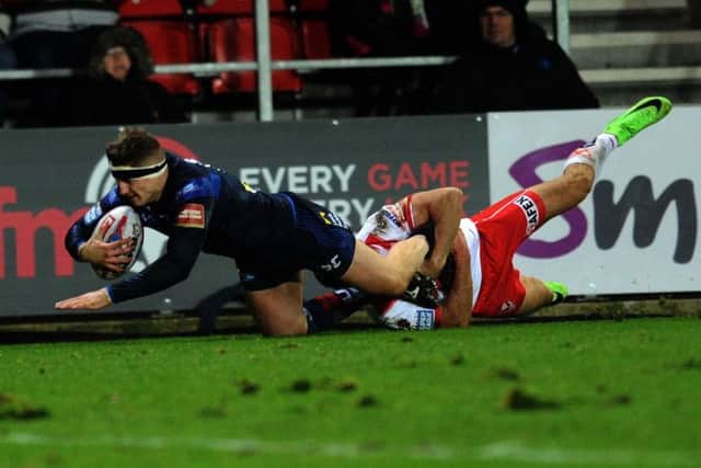 Tackle-of-the-season contender, Tommy Makinson on Leeds' Liam Sutcliffe.