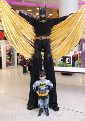 FUN DAY: Five-year-old Dylan Peat, of Bramley, meets his hero Batman. PIC: Steve Riding