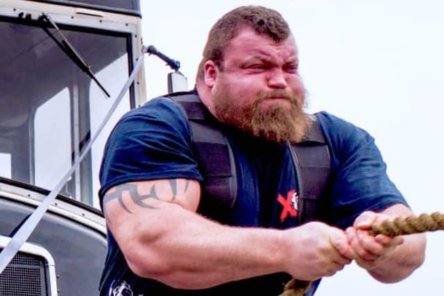 How strongman Eddie 'The Beast' Hall takes the bus in Leeds - puling it with his bare hands.
