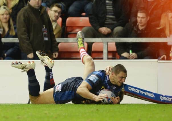 Ryan Hall touches down for the Rhinos' second try at Leigh.
