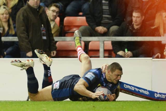 Ryan Hall touches down for the Rhinos' second try at Leigh.