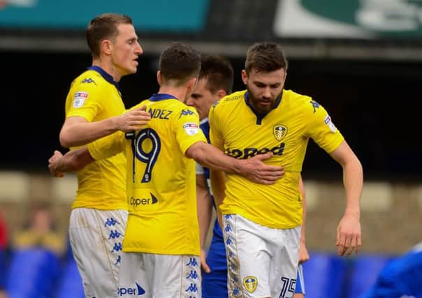Chris Wood and Pablo Hernandez congratulate Stuart Dallas, right, on his goal at Ipswich.