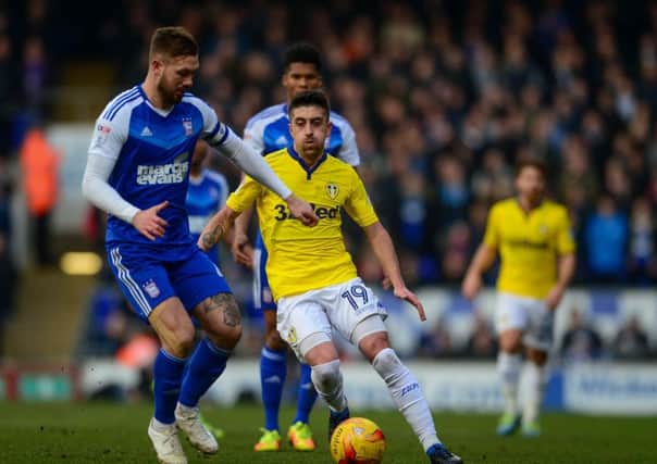 BATTLE: Ipswich Town's Luke Chambers tussles with Leeds United's Pablo Hernandez. Picture: James Hardisty.
