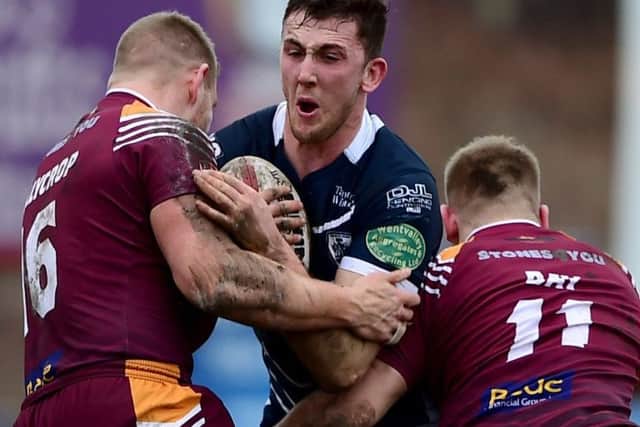 Featherstone's Jordan Baldwinson takes some stopping at Mount Pleasant.