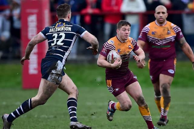 Alistair Leak, of Batley, is closed down by Featherstone's Jordan Baldwinson.