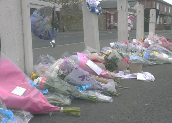 Floral tributes at the scene.
