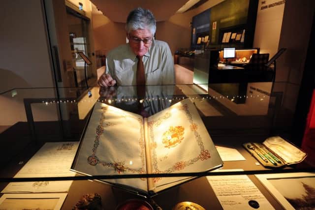 New Exhibition Caught in the Russian Revolution at the Parkinson Building, Leeds..Curator Richard Davies looks at the Patent of Russian Nobility at the Exhibition.22nd February 2017 ..Picture by Simon Hulme