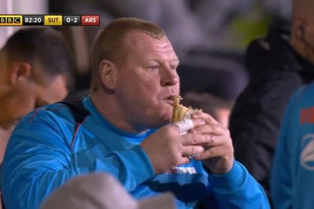 Wayne Shaw eating a pie during the game. Photo: BBC1