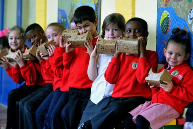 220217  Pupils at Cottingley Primary Academy School in Leeds looking through Virtual Reality viewers at different scenes including the Barrier Reef, Dinosaurs and Space.
