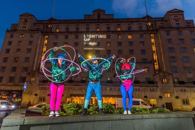 The Light's Light Up Hula Hoop performers Marawa's Marjorettes, with Inspector Spectrum, promoting the forthcoming event infront of the Queen's Hotel, City Square, Leeds.