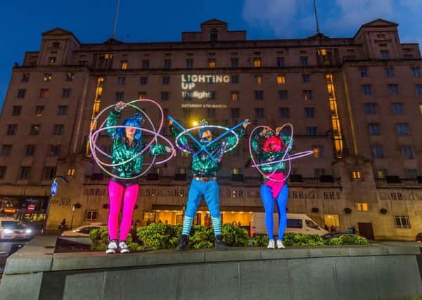 The Light's Light Up Hula Hoop performers Marawa's Marjorettes, with Inspector Spectrum, promoting the forthcoming event infront of the Queen's Hotel, City Square, Leeds.