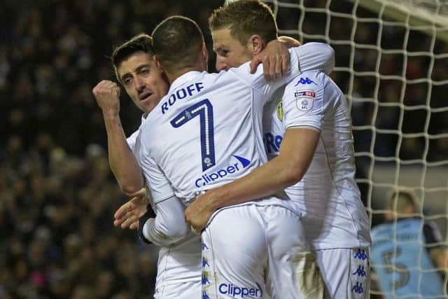 Chris Wood celebrates with Pablo Hernandez and Kemar Roofe.