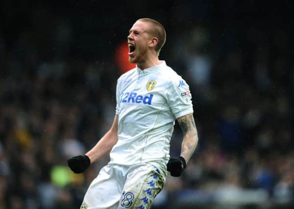Leeds United's Pontus Jansson celebrates with the fans. Picture Jonathan Gawthorpe.