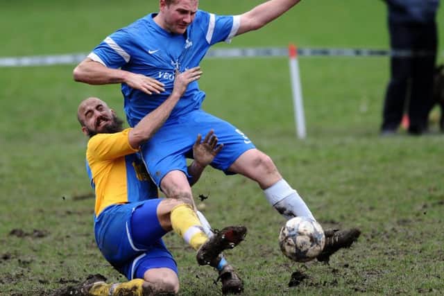 Hope Inn's Stewart Berry gets to grips with Steve Palfrey, of HT Sports. PIC: Jonathan Gawthorpe