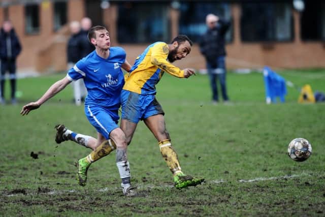 Hope Inn's Daniel Maw makes it 3-3 despite pressure from HT Sports' Sean Stevenson. PIC: Jonathan Gawthorpe