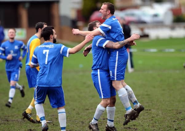 Byron Spink congratulates Steve Palfrey after his early goal straight from the kick off.