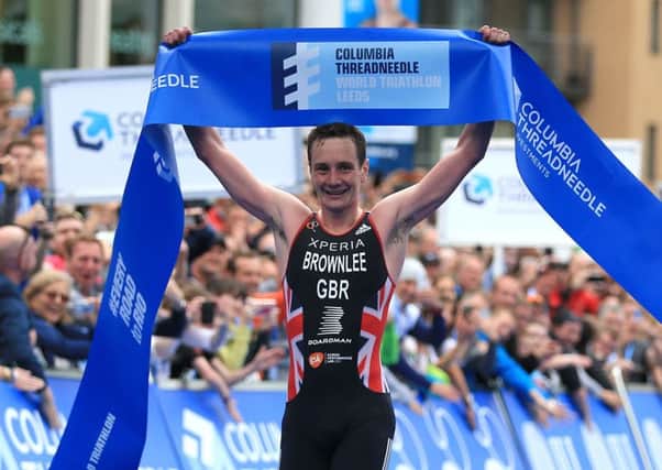 Great Britain's Alistair Brownlee crosses the line to win the gold medal in the Elite Men's ITU World Triathlon Series in Leeds. PRESS ASSOCIATION Photo. Picture date: Sunday June 12, 2016. Photo credit should read: Nigel French/PA Wire