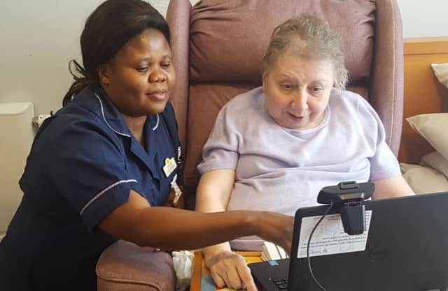 Mavis Robinson, who has benefitted from telehealth, with Esther Mulenge.