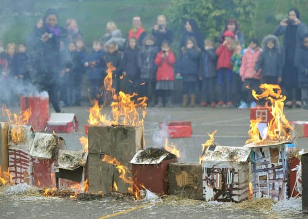 DEMONSTRATION: Pupils at Carr Manor Primary School watch the fire. PIC: Gary Longbottom