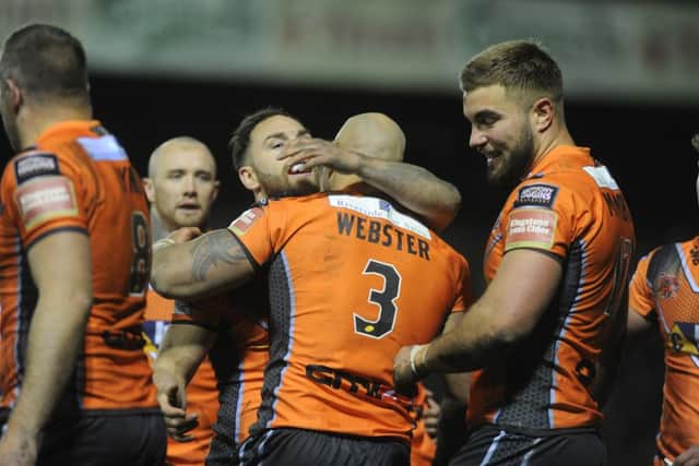Castleford Tigers' Jake Webster celebrates his try against Leeds on Thursday night. Picture: Steve Riding.