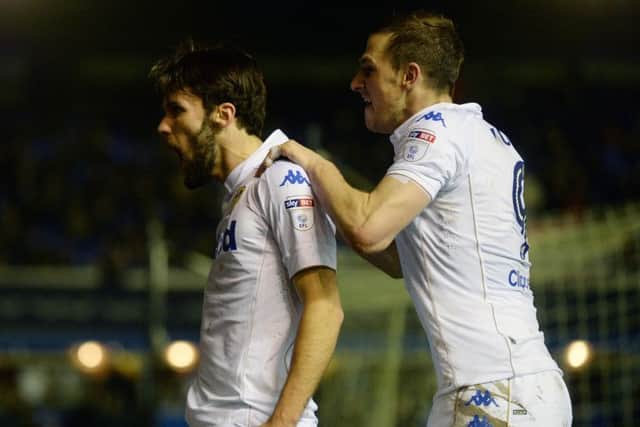 Alfonso Pedraza celebrates scoring Leeds' third goal with Chris Wood.