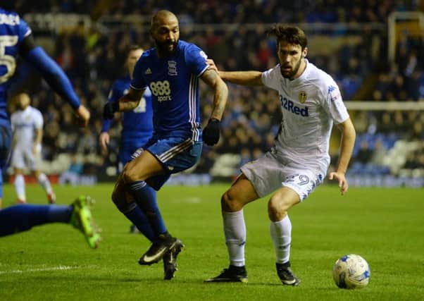 Leeds United's Alfonso Pedraza holds off Birmingham City's Emilio Nsue.